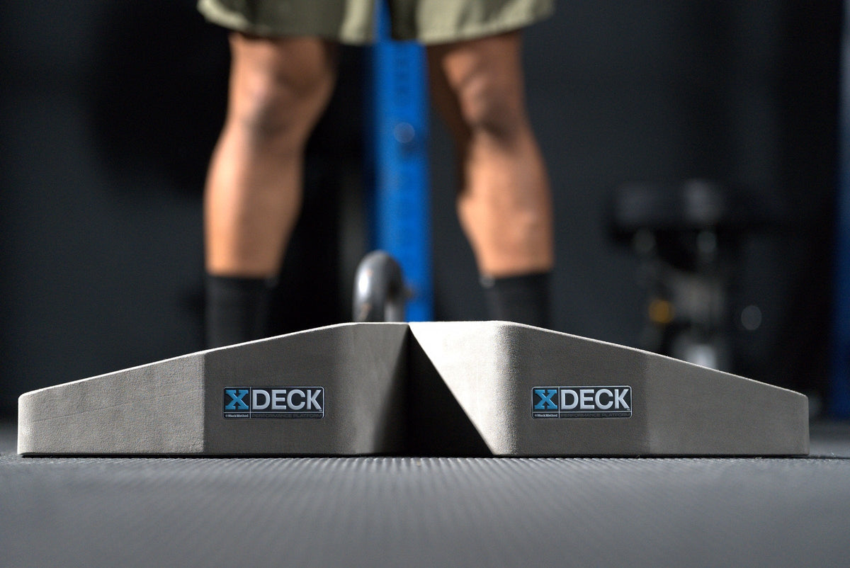 A pair of XDECK training platforms on a gym floor