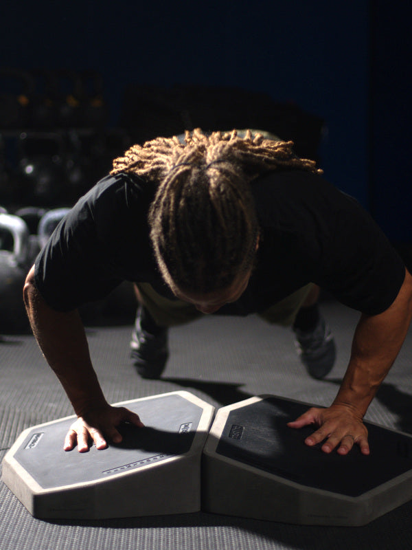 A push-up with both hands level on two XDECKs set flush side by side