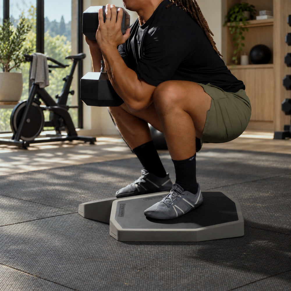 Goblet squat with both feet on the XDECK in a home gym