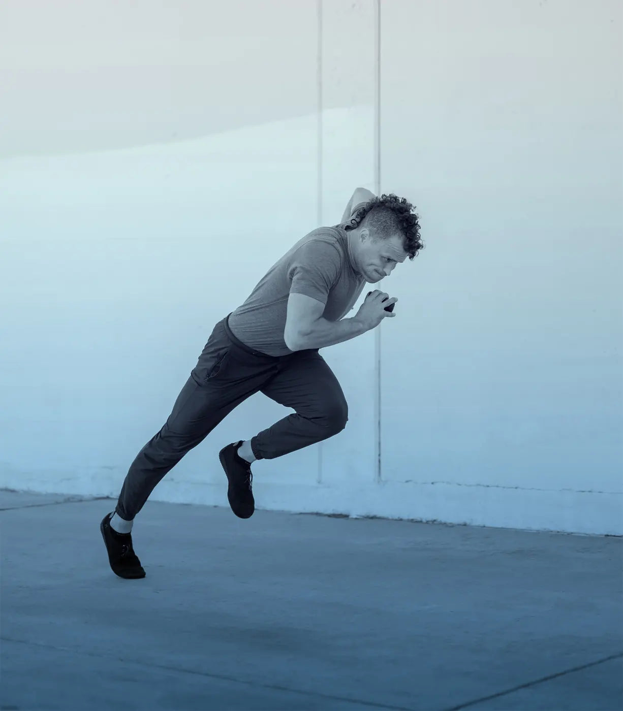 Athlete driving forward with ProPulse Speed Trainers